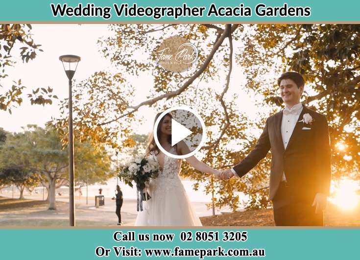 Bride and Groom hold hands at the park Acacia Gardens NSW 2763