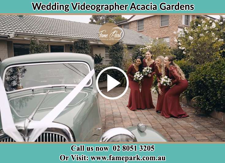 Bride's secondary sponsors looking at the bridal car Acacia Gardens NSW 2763