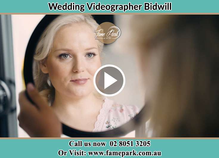 Bride looking at the mirror Bidwill NSW 2770