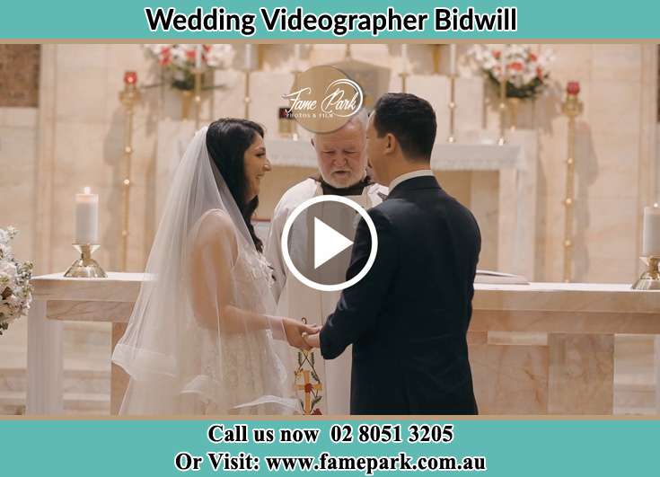 Bride and Groom at the altar with the priest Bidwill NSW 2770