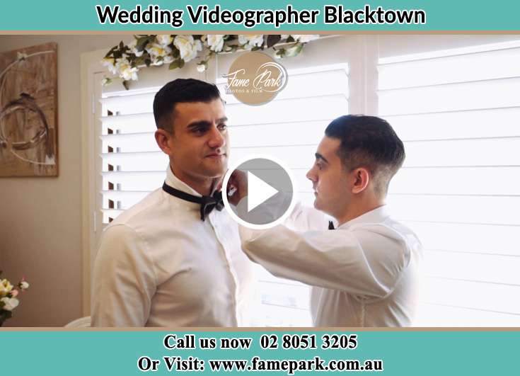 Groom bow tie being fixed by his best man Blacktown NSW 2148