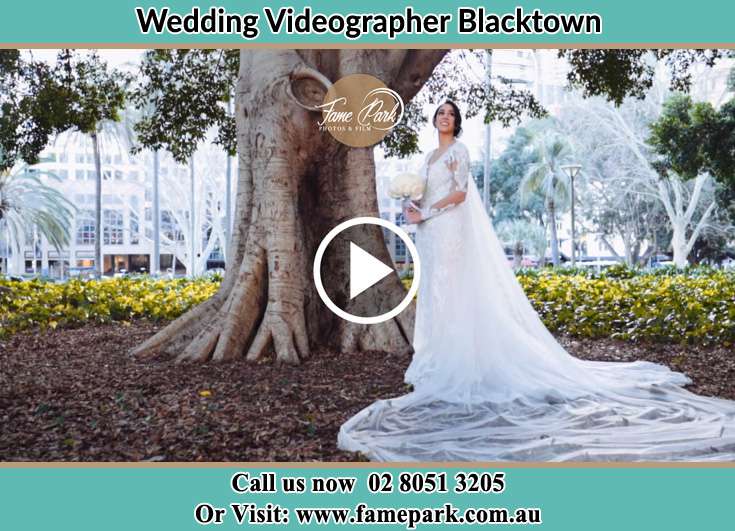 Bride holding a bouquet of flowers under the tree Blacktown NSW 2148