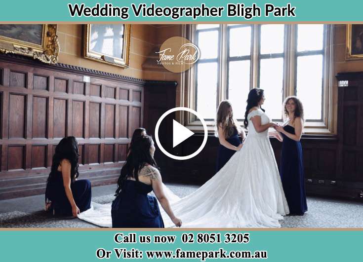 Bride and her secondary sponsors fixing her gown Bligh Park NSW 2756