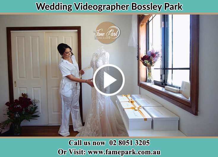 Bride looking at her wedding dress Bossley Park NSW 2176