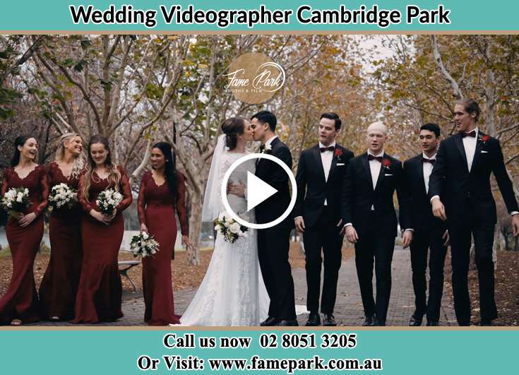 Bride and Groom kissed at the park with their secondary sponsors Cambridge Park NSW 2747