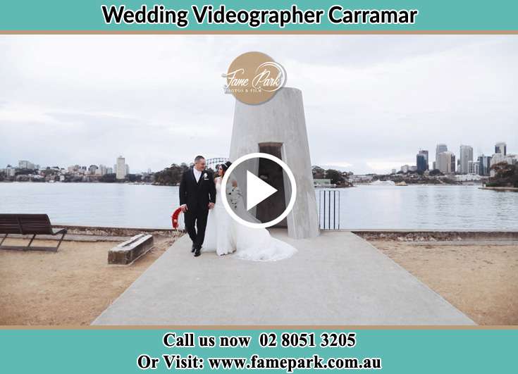 Bride and Groom hold hands at the bay Carramar NSW 2163