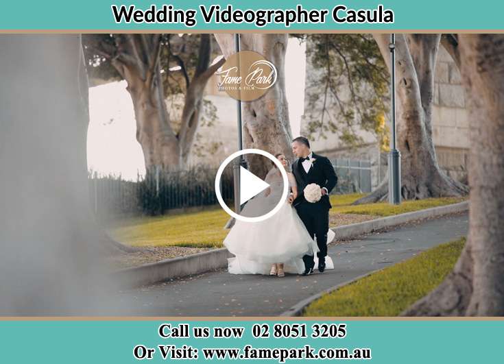 Bride and Groom looking at each other while walking in the park Casula NSW 2170