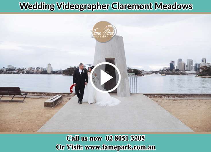 Bride and Groom walk near the shore crowds Claremont Meadows NSW 2747