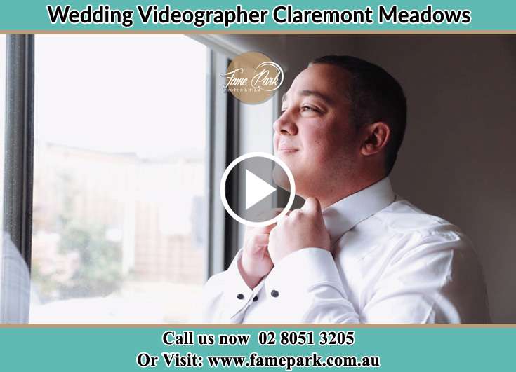 Groom getting ready while looking at the window Claremont Meadows NSW 2747