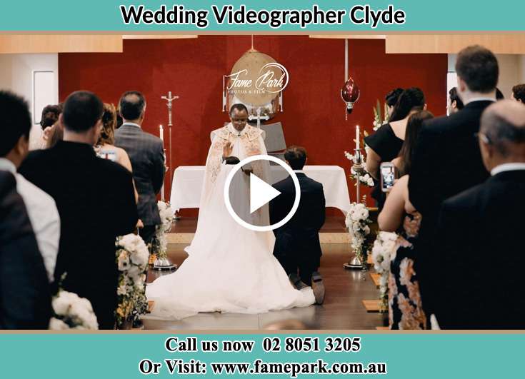 Bride and Groom kneeling at the altar Clyde NSW 2142