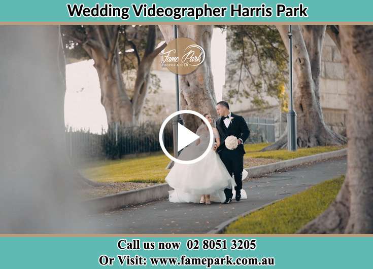 Bride and Groom looking at each other while walking in the park Harris Park NSW 2150