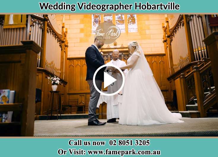 Bride and Groom at the altar with the priest Hobartville NSW 2753