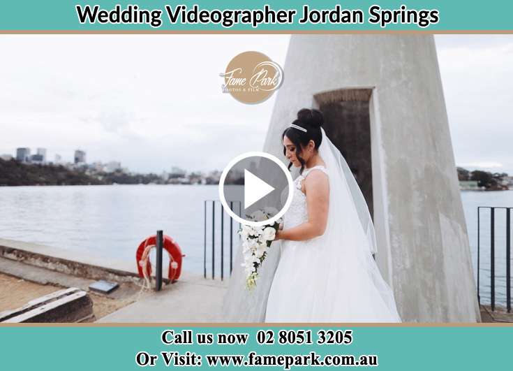 Bride with bouquet of flowers near the shore Jordan Springs NSW 2747