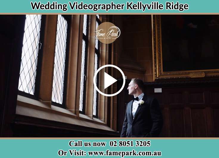 Groom looking at the church window Kellyville Ridge NSW 2155