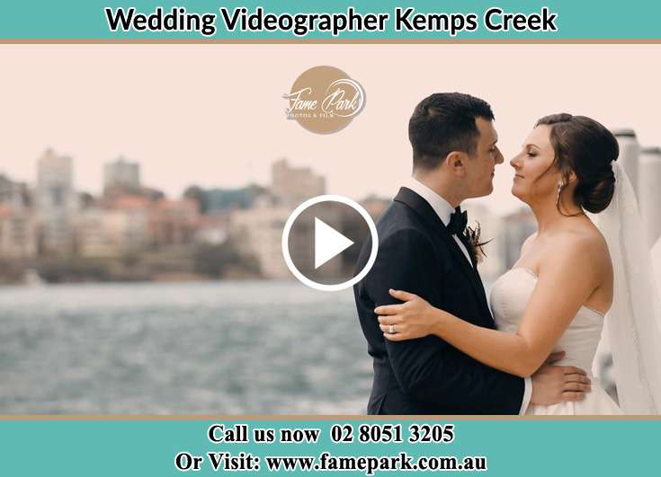 Bride and Groom looking at each other at the bay Kemps Creek NSW 2178