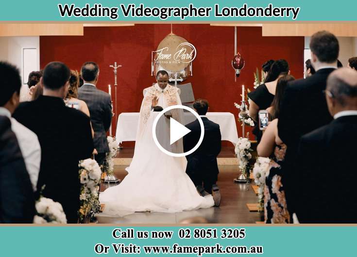 Bride and Groom kneel at the altar during the ceremony Londonderry NSW 2753