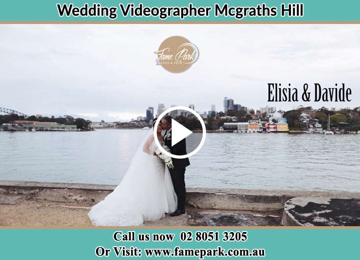 Bride and Groom kissed near the shores Mcgraths Hill NSW 2756