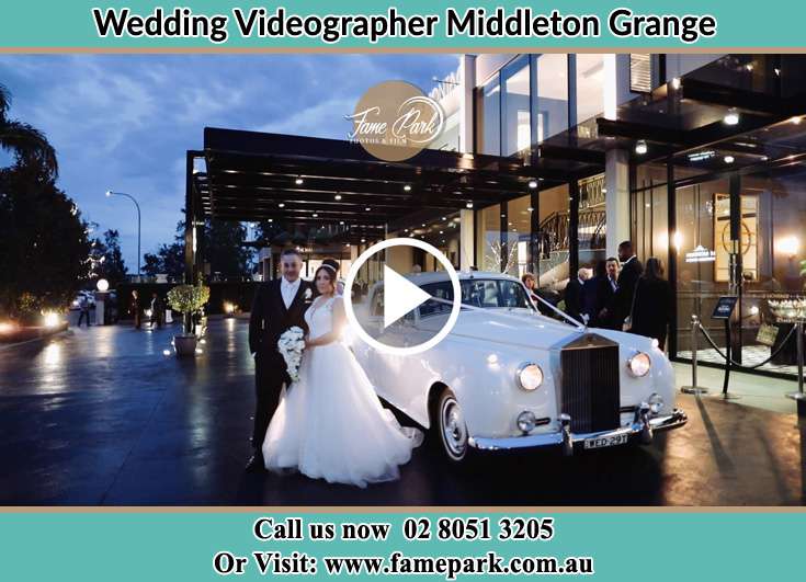 Bride and Groom near their bridal car Middleton Grange NSW 2171