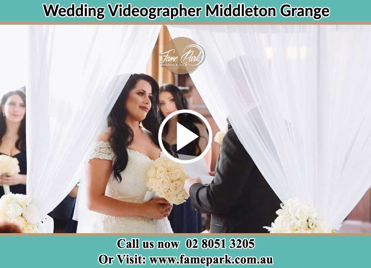 Bride and Groom looking at each other during the ceremony Middleton Grange NSW 2171