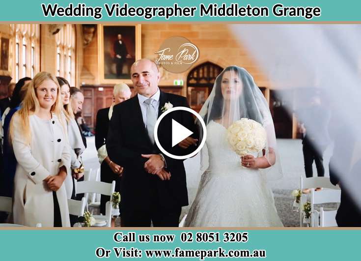 Bride and her father walking at the church aisle Middleton Grange NSW 2171