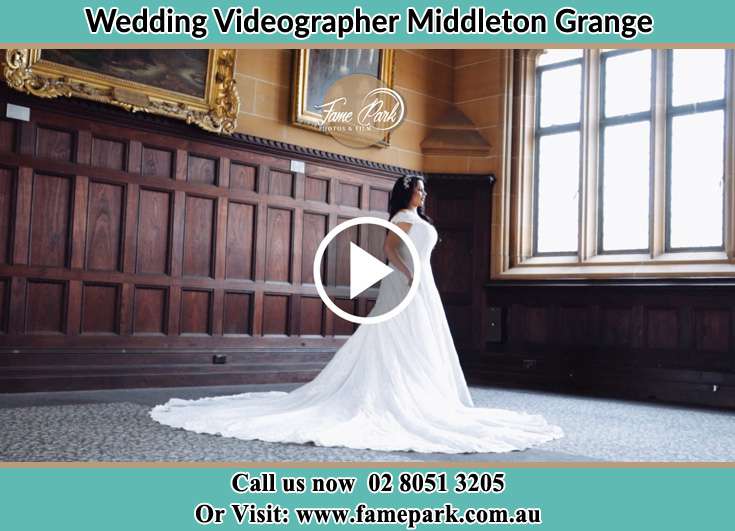 Bride looking at the church window Middleton Grange NSW 2171