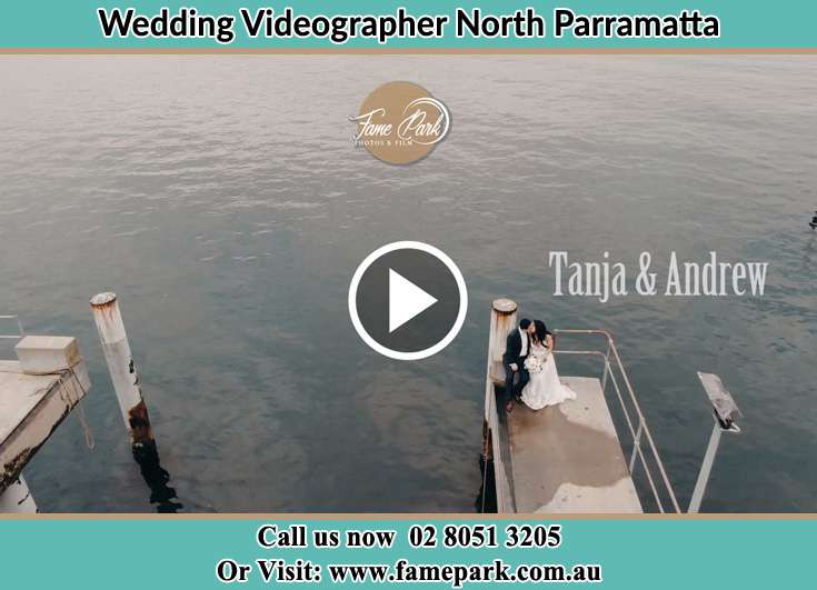 The newlyweds kissing near the shore North Parramatta NSW 2151