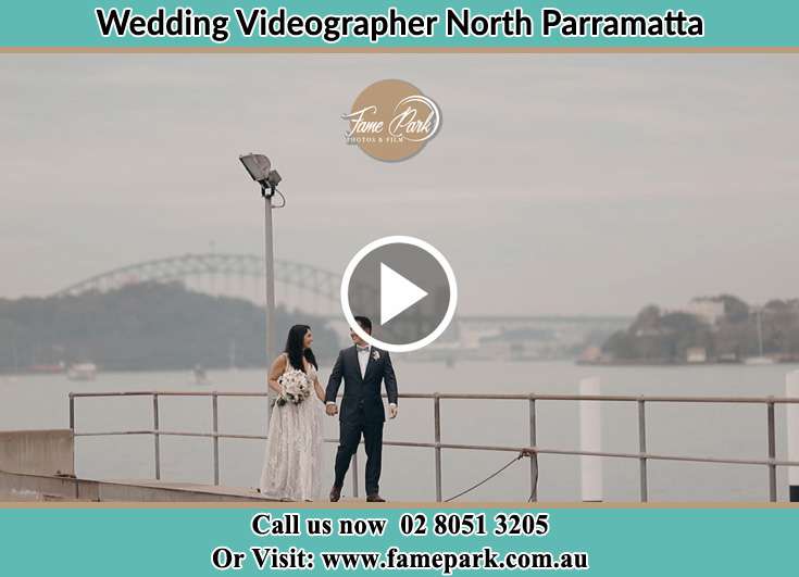 The Groom and the Bride walking along the shore North Parramatta NSW 2151