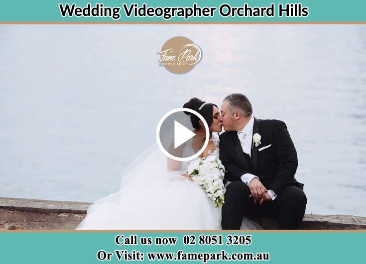 The new couple kissing near the shore Orchard Hills NSW 2748