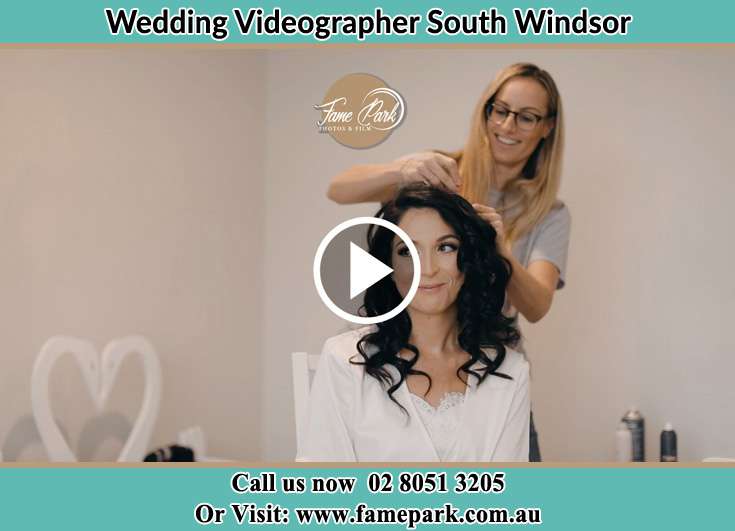 The hairdresser fixing the hair of the Bride South Windsor NSW 2756