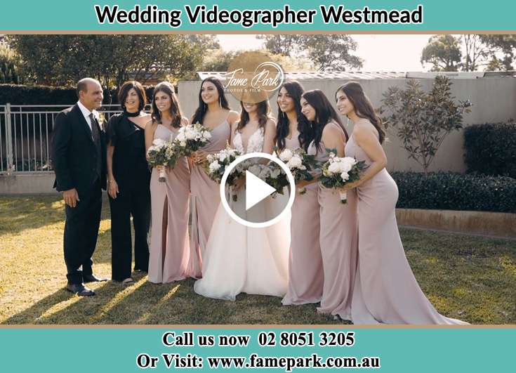 The Bride and her family with the bridesmaids posing for the camera Westmead NSW 2145