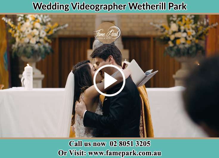 The new couple kissing during the wedding rites Wetherill Park NSW 2164